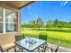 Relaxing patio with outdoor seating and beautiful water views at 18441 New London Ave, Land O Lakes, FL 34638