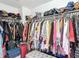 Walk-in closet with metal shelving and plenty of storage space at 18441 New London Ave, Land O Lakes, FL 34638