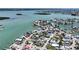 Aerial view of waterfront neighborhood with a canal and docks for boats at 13116 Boca Ciega Ave, Madeira Beach, FL 33708