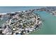 Scenic aerial shot of a neighborhood with waterfront homes on a sunny day at 13116 Boca Ciega Ave, Madeira Beach, FL 33708
