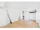 Unfinished basement area with wood-look flooring and white walls at 13116 Boca Ciega Ave, Madeira Beach, FL 33708