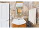 Bathroom features a sink, mirror, and beautiful tiling at 13116 Boca Ciega Ave, Madeira Beach, FL 33708
