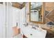 Bathroom sink and tiled walls at 13116 Boca Ciega Ave, Madeira Beach, FL 33708