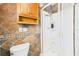 Bathroom with shower and cabinet at 13116 Boca Ciega Ave, Madeira Beach, FL 33708