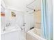 Bright bathroom with a soaking tub, walk-in shower, double vanity, and marble accents at 13116 Boca Ciega Ave, Madeira Beach, FL 33708
