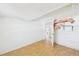 Bedroom with wood-look tile flooring, closet, offering potential for customization and updates at 13116 Boca Ciega Ave, Madeira Beach, FL 33708