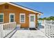 Inviting deck with a pineapple welcome mat offering a sunny spot for relaxation at 13116 Boca Ciega Ave, Madeira Beach, FL 33708