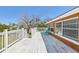 Sun-drenched deck with outdoor seating, ideal for enjoying the weather and outdoor living at 13116 Boca Ciega Ave, Madeira Beach, FL 33708