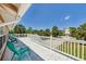 Spacious white deck with views of the surrounding neighborhood, perfect for outdoor lounging at 13116 Boca Ciega Ave, Madeira Beach, FL 33708