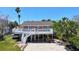 Charming home with a spacious white deck perfect for outdoor living and entertaining at 13116 Boca Ciega Ave, Madeira Beach, FL 33708