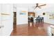 Living room and Kitchen with wood floors and a ceiling fan at 13116 Boca Ciega Ave, Madeira Beach, FL 33708