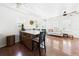 Open living space with kitchen island and seating, wood floors and plenty of natural light at 13116 Boca Ciega Ave, Madeira Beach, FL 33708