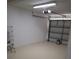 Spacious garage featuring painted walls, clean floor, and overhead door at 418 40Th S Ave, St Petersburg, FL 33705