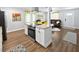 Spacious kitchen layout with a central island, stainless steel appliances, and seamless access to the living area at 418 40Th S Ave, St Petersburg, FL 33705
