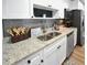Well-lit kitchen featuring granite countertops, stainless steel appliances, and modern fixtures at 418 40Th S Ave, St Petersburg, FL 33705