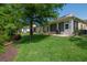 Beautiful green backyard view featuring a patio and well-maintained lawn at 1188 Royal Blvd, Palm Harbor, FL 34684