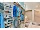 Spacious closet with mirrored door leading to a bathroom; great for organization at 1188 Royal Blvd, Palm Harbor, FL 34684