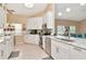 Modern kitchen featuring white cabinets, granite countertops, stainless steel appliances and eat in nook at 1188 Royal Blvd, Palm Harbor, FL 34684