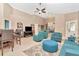 Open-concept living space with tile floors, comfortable seating, and access to kitchen at 1188 Royal Blvd, Palm Harbor, FL 34684