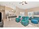 Bright living room with tile floors, bar seating, and a view into the kitchen at 1188 Royal Blvd, Palm Harbor, FL 34684