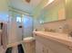 Cozy bathroom with shower, tile floor, bright walls and sink with vanity at 2311 Brisbane St # 29, Clearwater, FL 33763