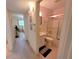 Cozy bathroom features a tub with shower and vanity with sink, accented by tiled floors at 2311 Brisbane St # 29, Clearwater, FL 33763