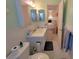 Cozy bathroom with shower, tile floor, bright walls and door to bedroom at 2311 Brisbane St # 29, Clearwater, FL 33763