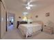 Bright bedroom featuring neutral walls, plush carpet, ceiling fan and view to study at 2311 Brisbane St # 29, Clearwater, FL 33763