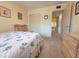 Bedroom featuring two chairs, a large window, and a view into the hallway at 2311 Brisbane St # 29, Clearwater, FL 33763