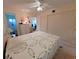 Comfortable bedroom with ceiling fan, large closet, and doorway to the bathroom at 2311 Brisbane St # 29, Clearwater, FL 33763