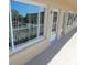 Exterior view of condo featuring large window with natural light and neutral paint at 2311 Brisbane St # 29, Clearwater, FL 33763