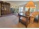Spacious living room featuring a china cabinet, fireplace, and plenty of comfortable seating at 2311 Brisbane St # 29, Clearwater, FL 33763