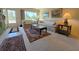 Cozy living room featuring large window, carpeted floors, comfortable seating and decorative rug at 2311 Brisbane St # 29, Clearwater, FL 33763