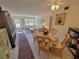 Open concept living room featuring table set, comfortable seating and lots of natural light at 2311 Brisbane St # 29, Clearwater, FL 33763