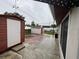 Spacious backyard featuring 2 sheds, a patio, and lawn space at 6019 W Fern St, Tampa, FL 33634