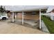 Exterior of home with carport and freshly painted with security bars on the windows at 6019 W Fern St, Tampa, FL 33634