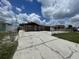 Charming single-story home with a well-maintained front yard and long driveway at 6019 W Fern St, Tampa, FL 33634
