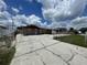 Charming single-story home with a well-maintained front yard and long driveway at 6019 W Fern St, Tampa, FL 33634