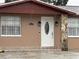 Charming front entrance of home with decorative columns and a classic door at 6019 W Fern St, Tampa, FL 33634