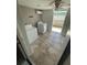 Functional laundry room with a washer, dryer, and tile flooring at 6019 W Fern St, Tampa, FL 33634