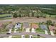 Wide aerial view showcasing homes within a well-maintained community with mature trees and landscaping at 6335 Cardinal Crest Dr, New Port Richey, FL 34655