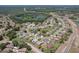 Overhead aerial view of single-Gathering homes in a well-planned neighborhood, situated near a tranquil lake at 6335 Cardinal Crest Dr, New Port Richey, FL 34655