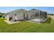 Backyard view of the home and pool, as well as the pool equipment hidden from view at 6335 Cardinal Crest Dr, New Port Richey, FL 34655