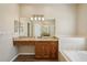 Bathroom with double sinks, granite countertops, and wood-look tile flooring at 6335 Cardinal Crest Dr, New Port Richey, FL 34655