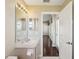 Neutral bathroom featuring a vanity and mirror, and tiled floors at 6335 Cardinal Crest Dr, New Port Richey, FL 34655