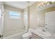 Standard bathroom with tiled shower and tub, vanity and a large mirror at 6335 Cardinal Crest Dr, New Port Richey, FL 34655