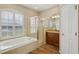 Bright bathroom with a tub and a shower at 6335 Cardinal Crest Dr, New Port Richey, FL 34655