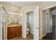 Bright bathroom with dual sink vanity, shower, and toilet area at 6335 Cardinal Crest Dr, New Port Richey, FL 34655