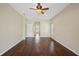 Bedroom with an overhead ceiling fan and wood floors at 6335 Cardinal Crest Dr, New Port Richey, FL 34655