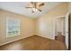 Cozy bedroom featuring wood-look floors and natural light at 6335 Cardinal Crest Dr, New Port Richey, FL 34655